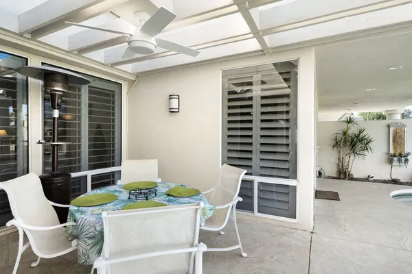 a view of a dining room with furniture and window