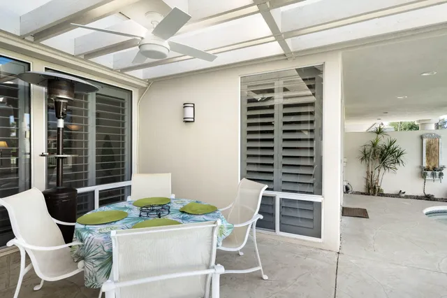 a view of a dining room with furniture and window