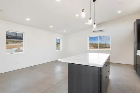 a kitchen with stainless steel appliances a stove sink and microwave