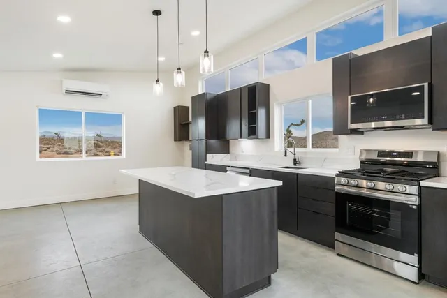 a bedroom with a bed and a chair