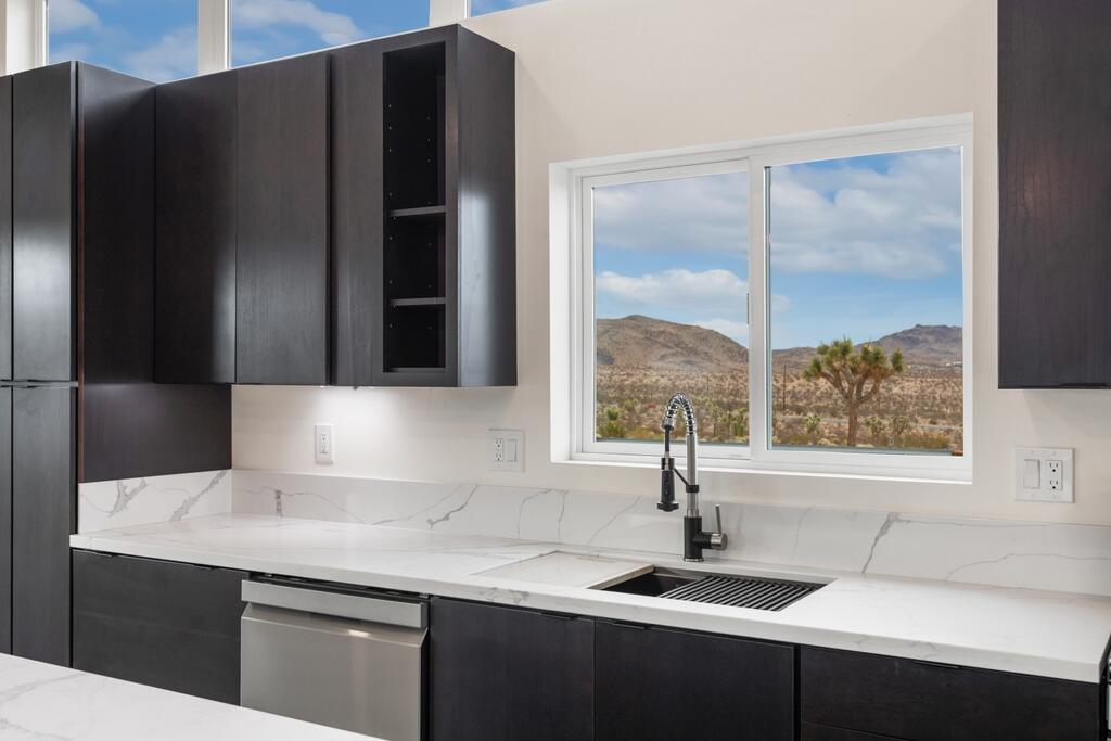 6689 Torres Avenue Joshua Tree, CA 92252 - Photo 20 of 48 a kitchen with a sink a refrigerator and window