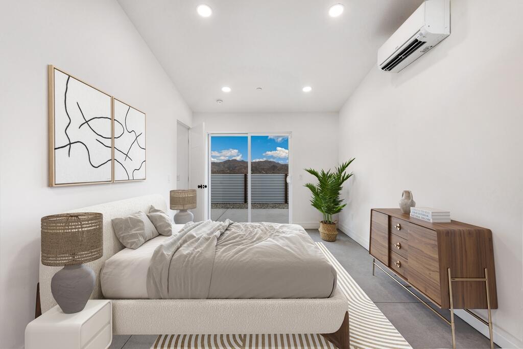 6689 Torres Avenue Joshua Tree, CA 92252 - Photo 21 of 48 a bedroom with a bed and a chair