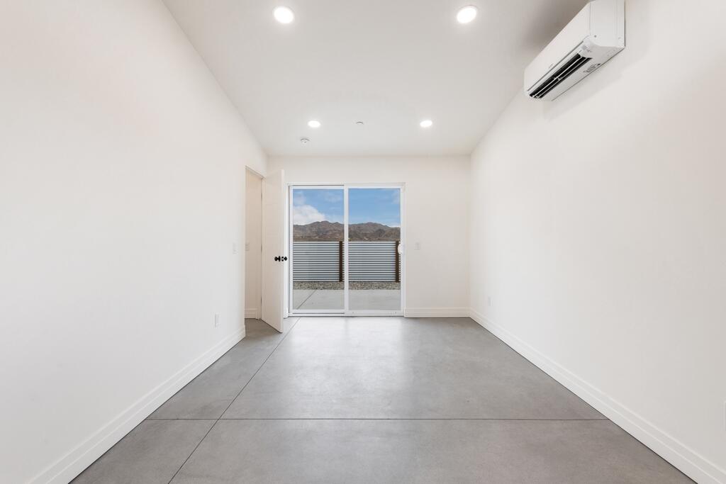 6689 Torres Avenue Joshua Tree, CA 92252 - Photo 22 of 48 an empty room with a natural light