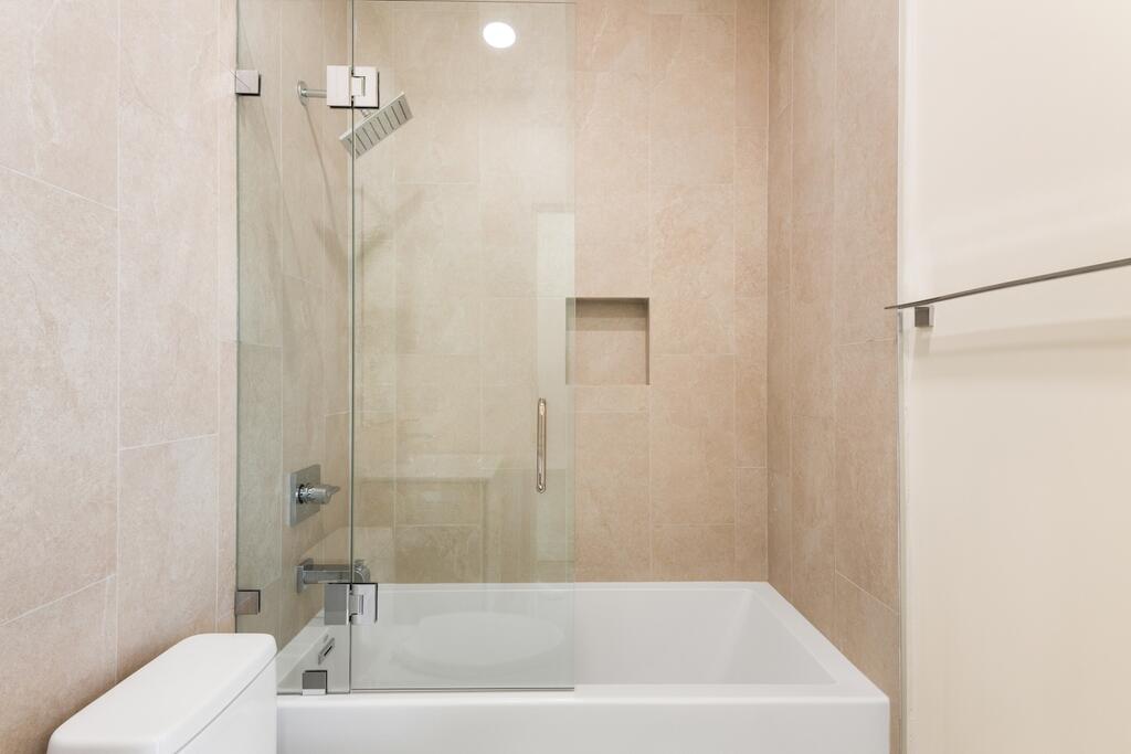 6689 Torres Avenue Joshua Tree, CA 92252 - Photo 33 of 48 a bath tub sitting next to a white toilet