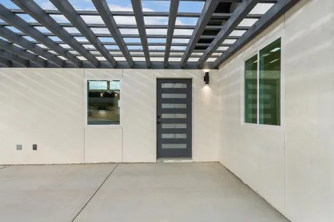 a kitchen with stainless steel appliances a refrigerator sink and stove
