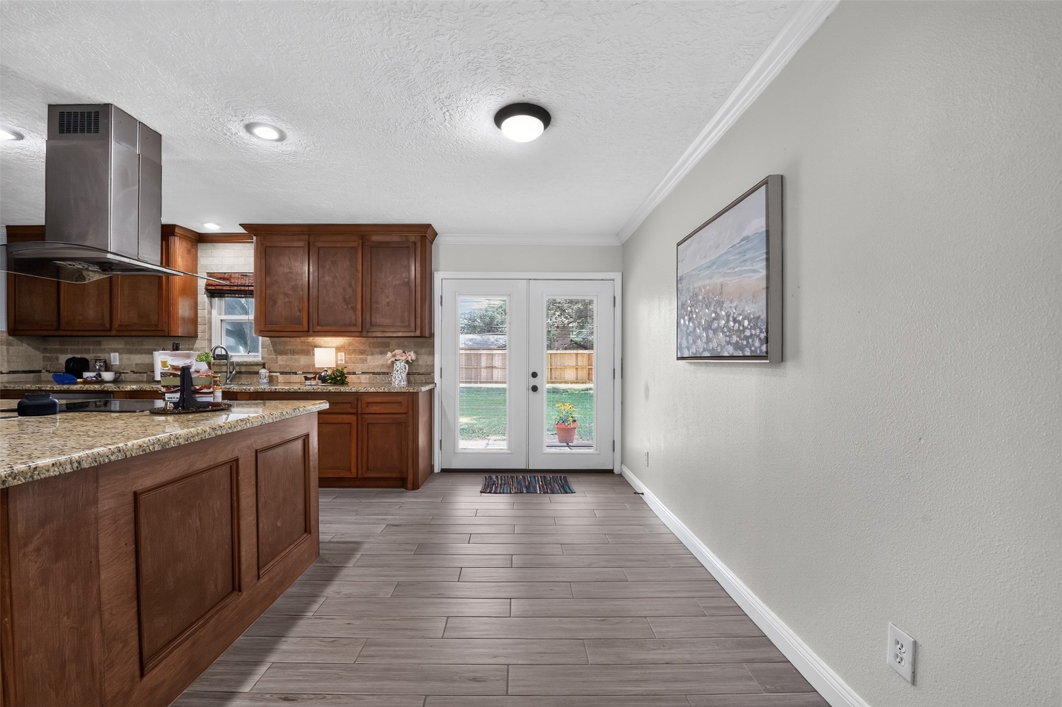 10407 Winding Trail Road La Porte, TX 77571 - Photo 15 of 40 Spacious kitchen and dining combination offers versatility for everyday living
