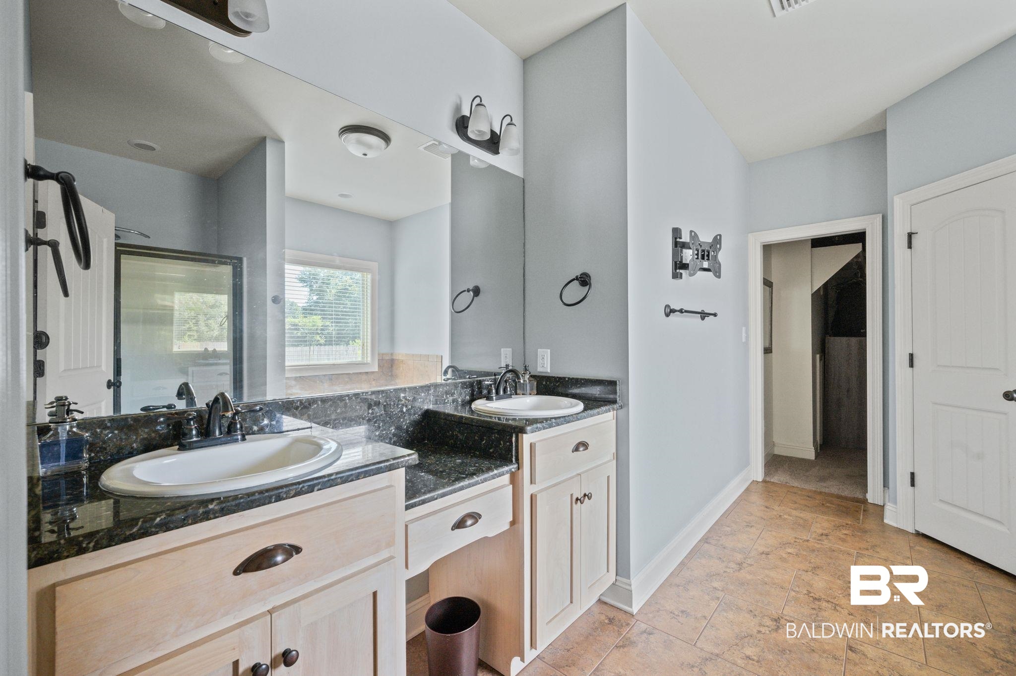 3879 Symphony Way West Semmes, AL 36575 - Photo 17 of 34 Bathroom with tile patterned flooring and double vanity