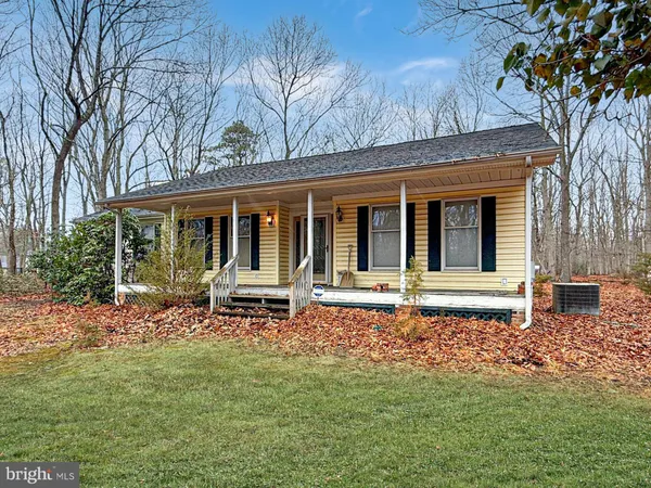a house with trees in front of it