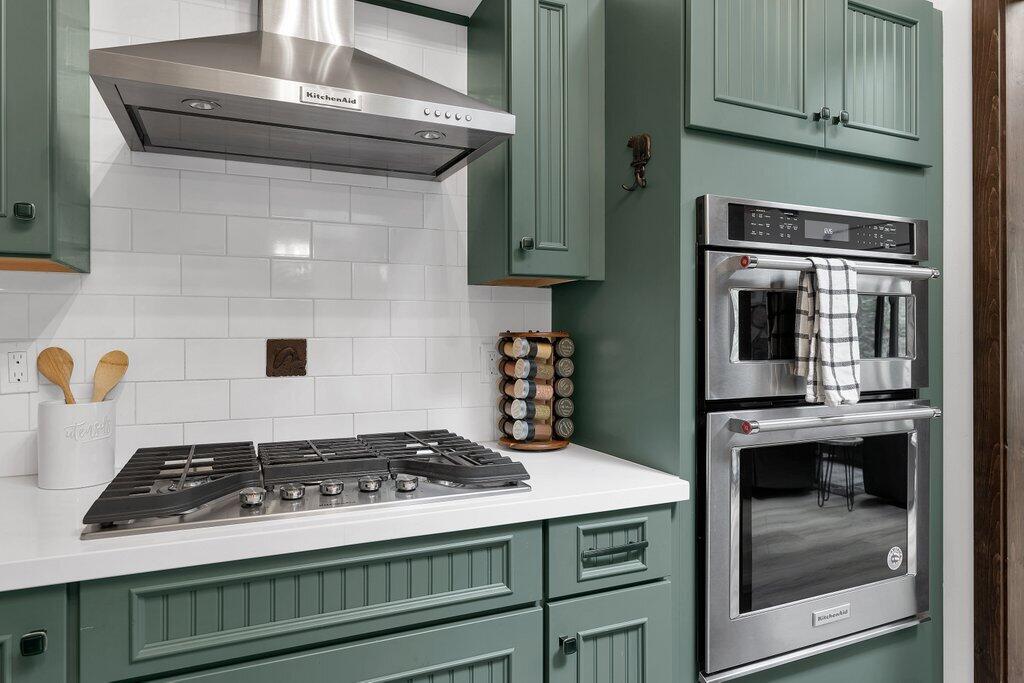 54495 South Circle Drive Idyllwild, CA 92549 - Photo 13 of 65 a stove top oven sitting inside of a kitchen