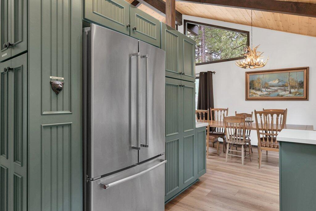 54495 South Circle Drive Idyllwild, CA 92549 - Photo 15 of 65 a kitchen with stainless steel appliances granite countertop a refrigerator and a table