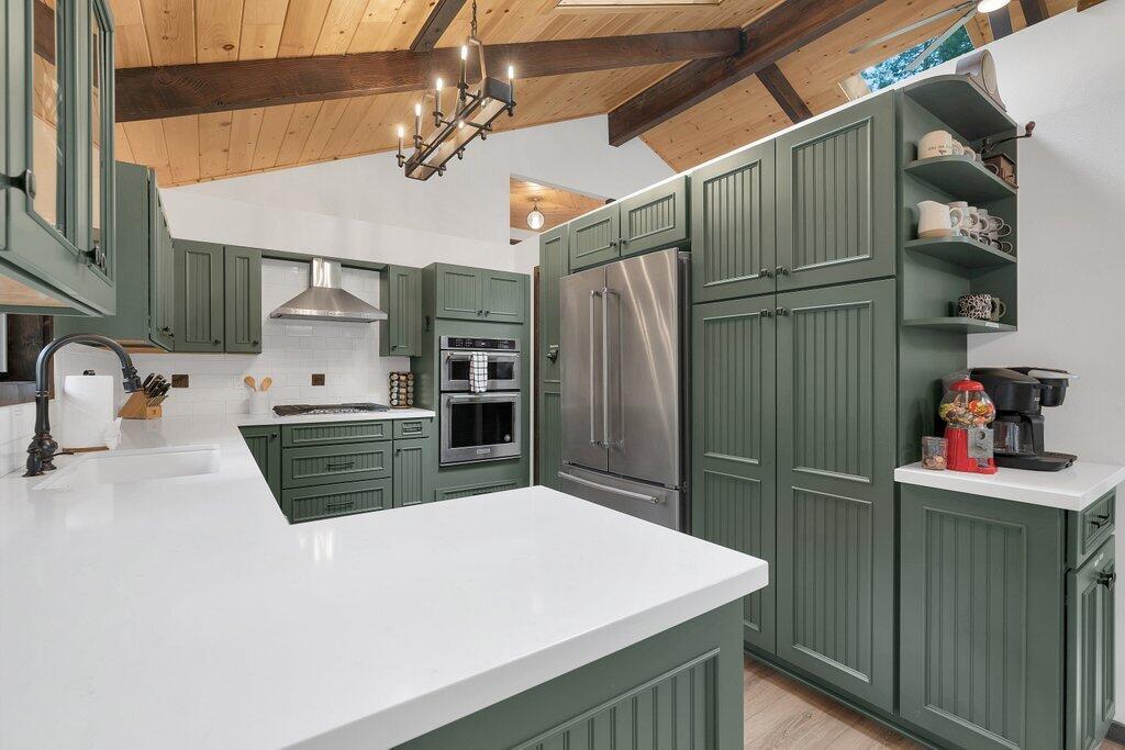 54495 South Circle Drive Idyllwild, CA 92549 - Photo 16 of 65 a kitchen with stainless steel appliances a refrigerator and a sink