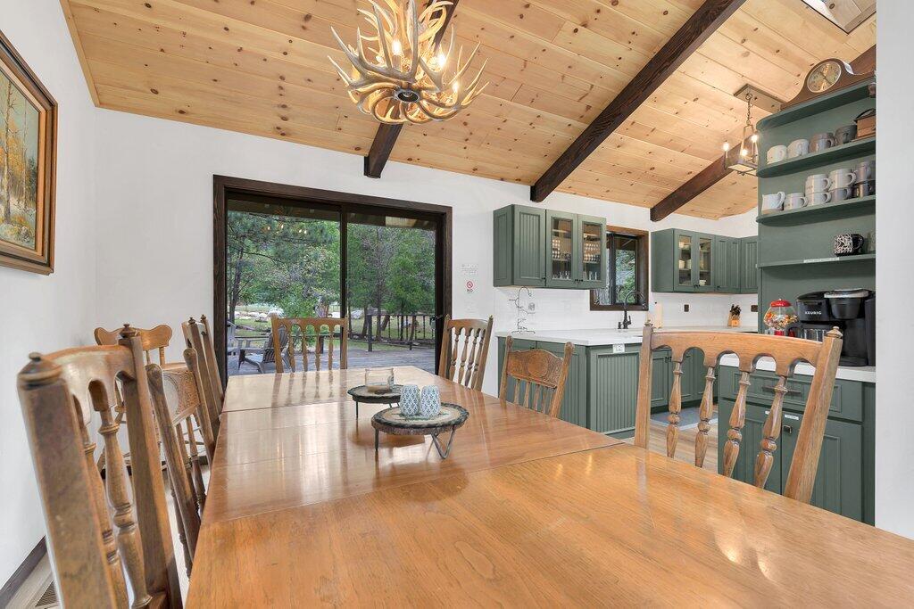 54495 South Circle Drive Idyllwild, CA 92549 - Photo 18 of 65 a living room with furniture a fireplace and a flat screen tv