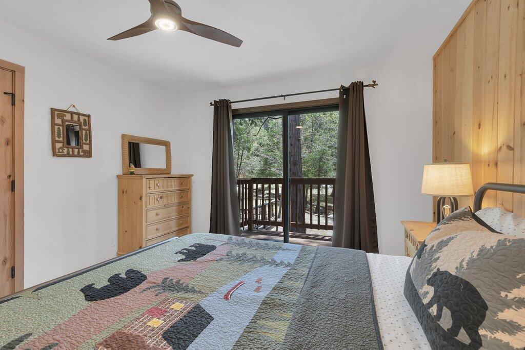 54495 South Circle Drive Idyllwild, CA 92549 - Photo 21 of 65 a bedroom with a bed and a large window