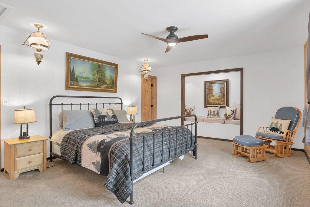 54495 South Circle Drive Idyllwild, CA 92549 - Photo 28 of 65 a bedroom with a bed a chair and piano