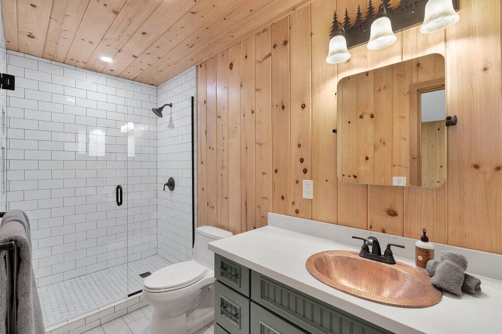 54495 South Circle Drive Idyllwild, CA 92549 - Photo 30 of 65 a bathroom with a sink a toilet and shower