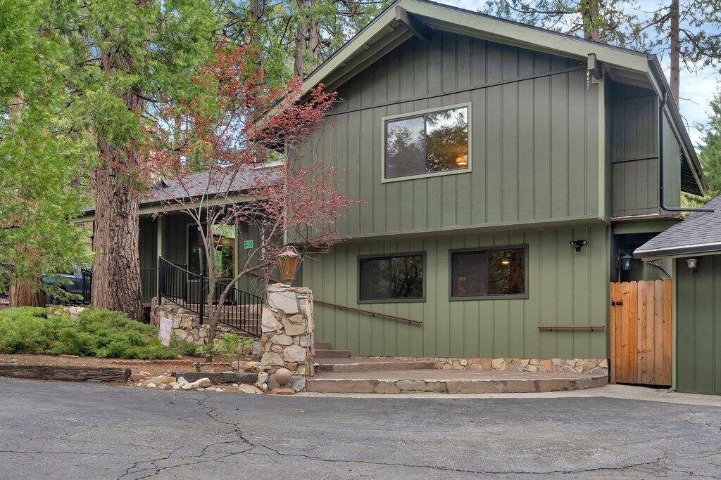 54495 South Circle Drive Idyllwild, CA 92549 - Photo 3 of 65 a front view of a house with garden