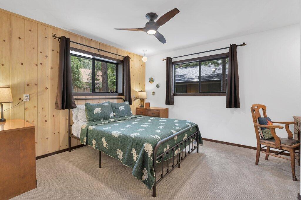 54495 South Circle Drive Idyllwild, CA 92549 - Photo 32 of 65 a bedroom with a bed a table and chair