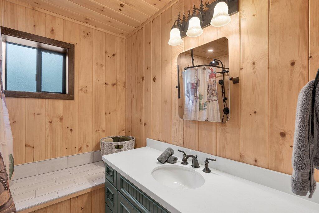 54495 South Circle Drive Idyllwild, CA 92549 - Photo 33 of 65 a bathroom with a sink vanity and a mirror
