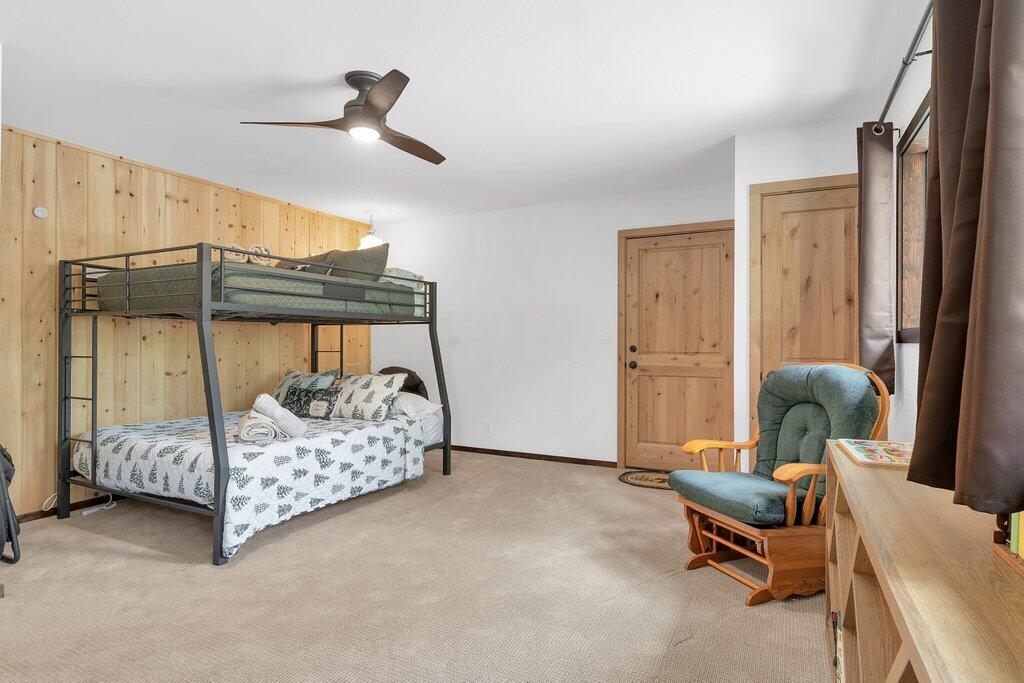 54495 South Circle Drive Idyllwild, CA 92549 - Photo 36 of 65 a bedroom with a bed and a chandelier