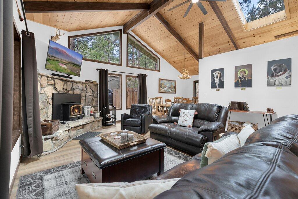 54495 South Circle Drive Idyllwild, CA 92549 - Photo 5 of 65 a living room with furniture a large window and a fireplace