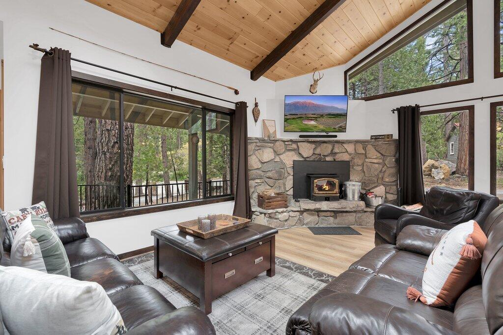 54495 South Circle Drive Idyllwild, CA 92549 - Photo 6 of 65 a living room with furniture fireplace and a large window