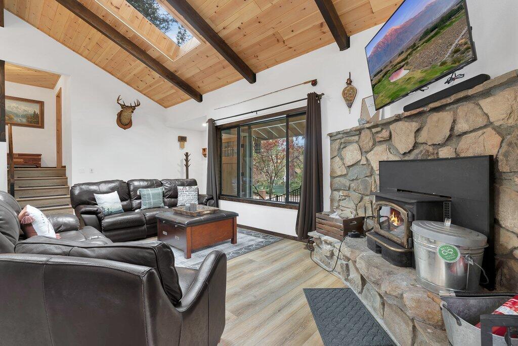54495 South Circle Drive Idyllwild, CA 92549 - Photo 9 of 65 a living room with fireplace furniture and a large window