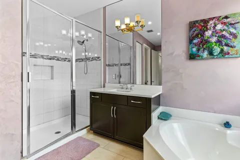 a bathroom with a sink a toilet and shower curtain