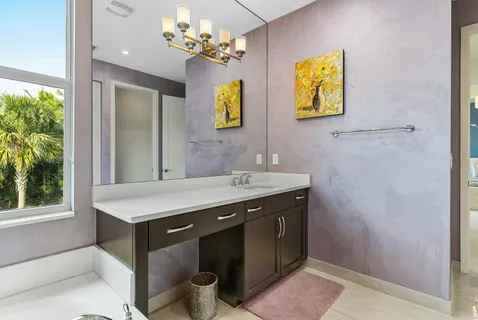 a view of a hallway with wooden floor and closet