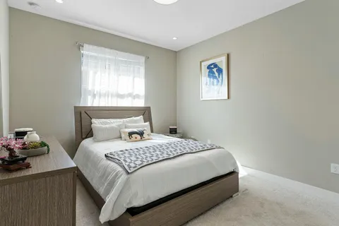 a view of a patio with table and chairs and potted plants