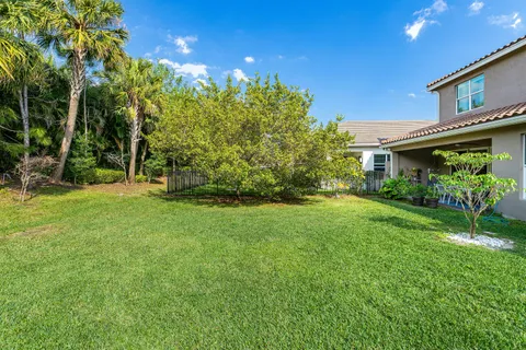 an aerial view of a house with garden space and street view