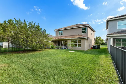 an aerial view of multiple houses with outdoor space