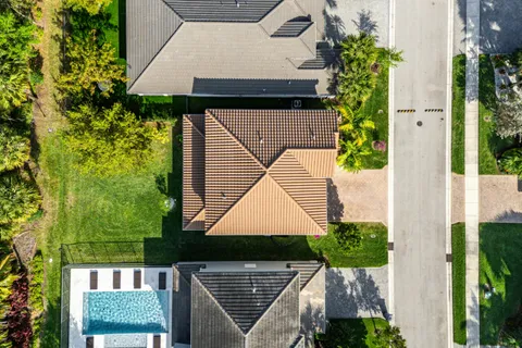 a living room with furniture a flat screen tv and a large window