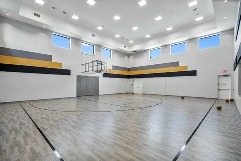 a view of a house with a yard and a garage