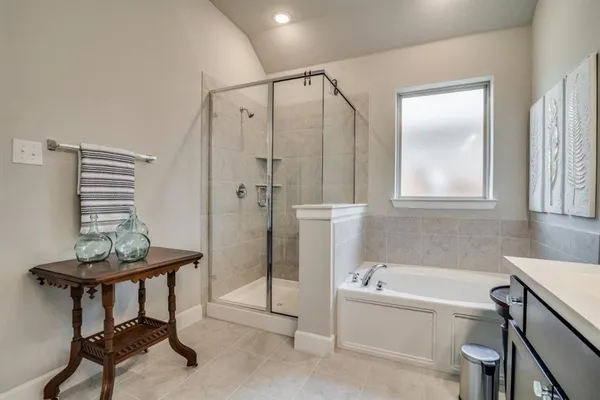a bathroom with a bathtub and a shower