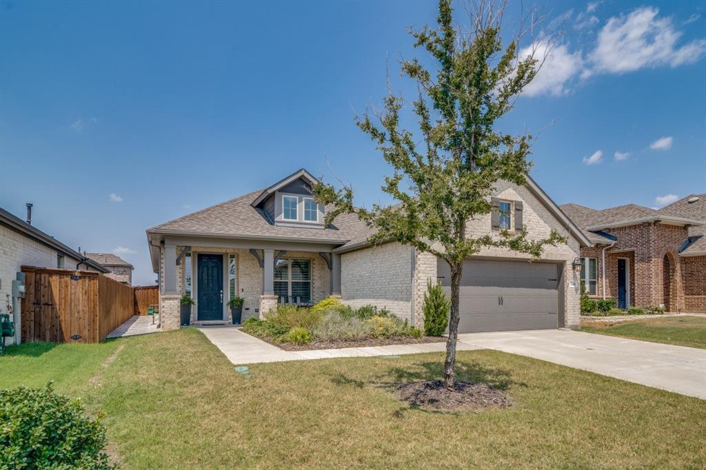 1268 Caprock Drive Forney, TX 75126 - Photo 3 of 35 a front view of a house with a yard and garage