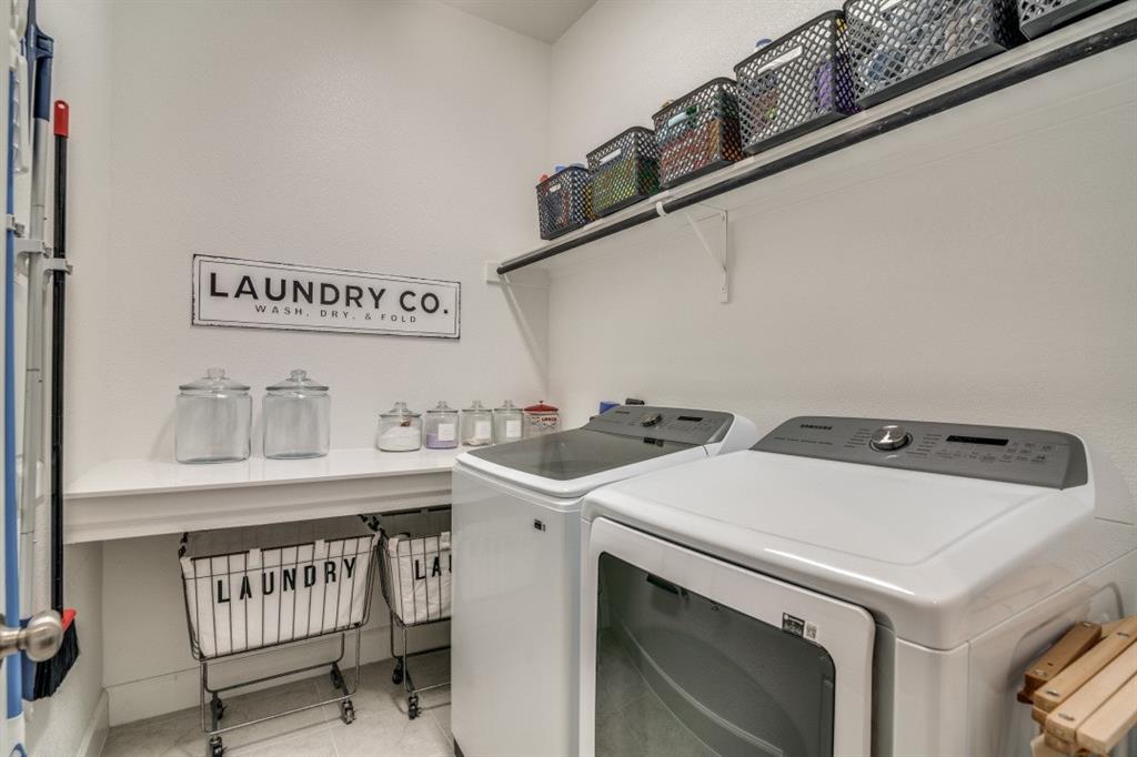 1268 Caprock Drive Forney, TX 75126 - Photo 33 of 35 a utility room with dryer and washer