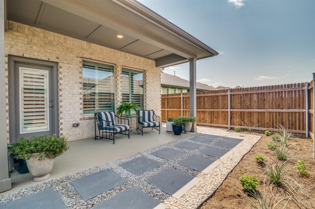 1268 Caprock Drive Forney, TX 75126 - Photo 34 of 35 a view of a house with backyard sitting area and tub