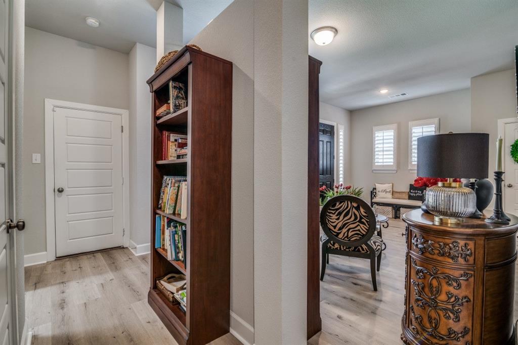 1268 Caprock Drive Forney, TX 75126 - Photo 8 of 35 a dining room with furniture and wooden floor