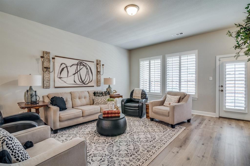 1268 Caprock Drive Forney, TX 75126 - Photo 10 of 35 a living room with furniture and a large window