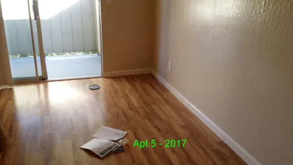 a view of an empty room with a window