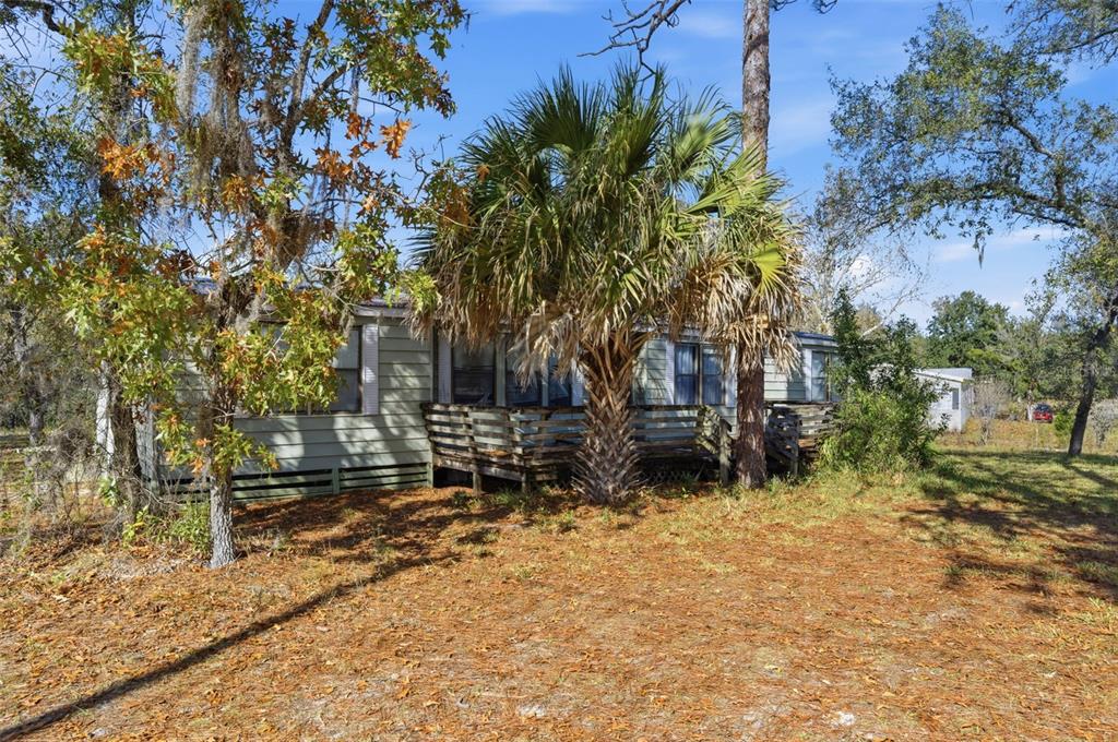 8045 Indian Trail Road Weeki Wachee, FL 34613 - Photo 39 of 49 a view of house with a yard