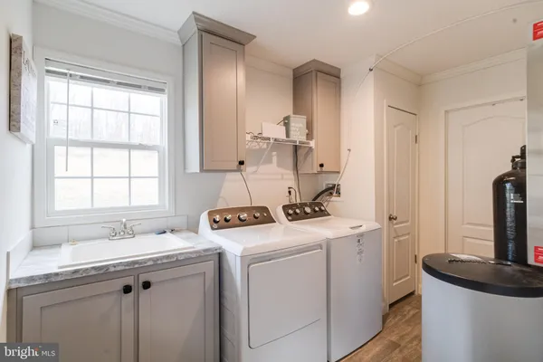 a view of cabinets and wooden floor