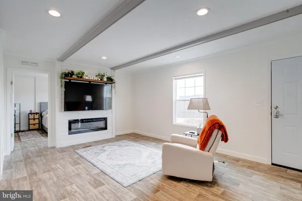 a bedroom with furniture and window