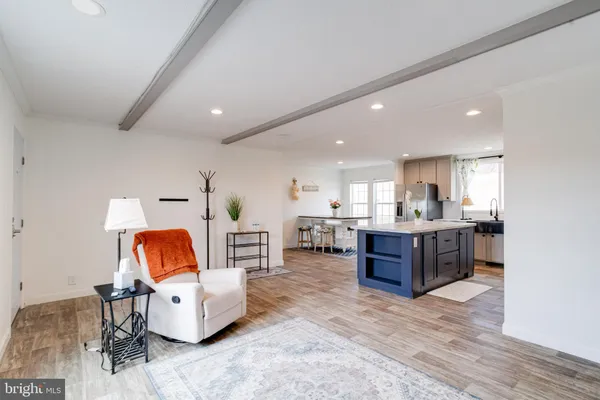 a kitchen with stainless steel appliances granite countertop a stove refrigerator sink and cabinets