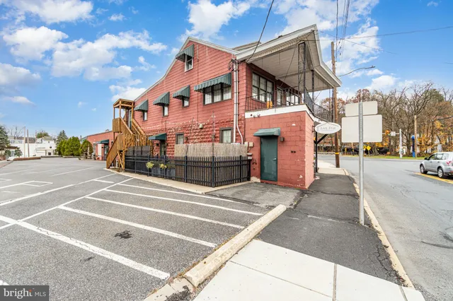 a view of a street with a building in the background