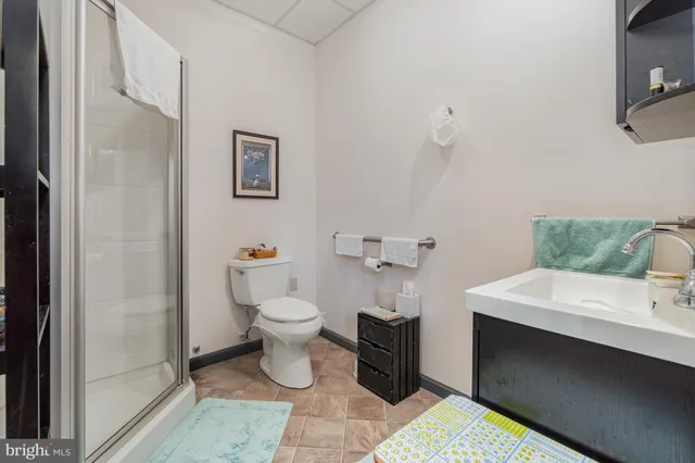 a bathroom with a sink toilet and vanity