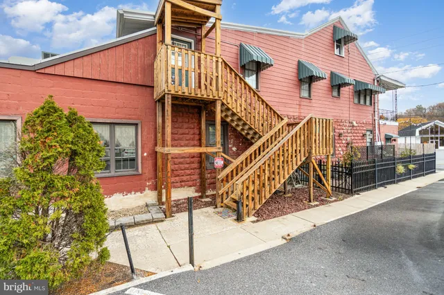 front view of a house with a street