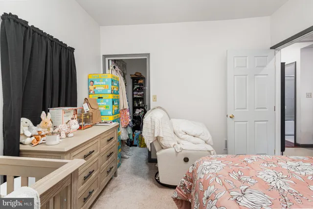 a bedroom with a bed furniture and a window