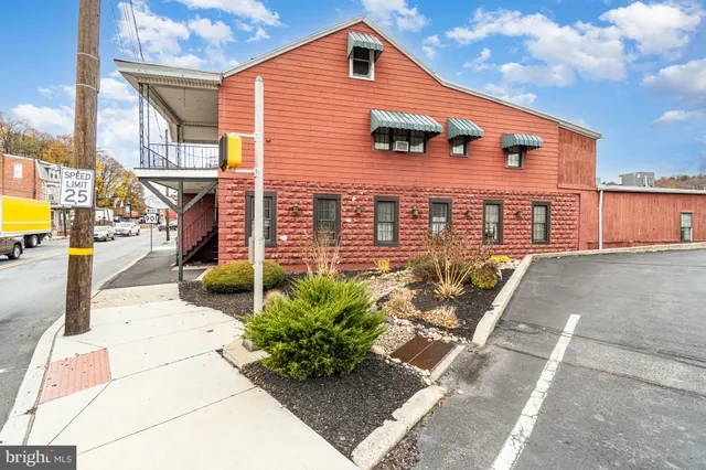 a front view of a house with outdoor space