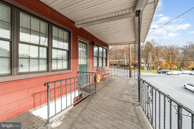 a view of a porch and garden